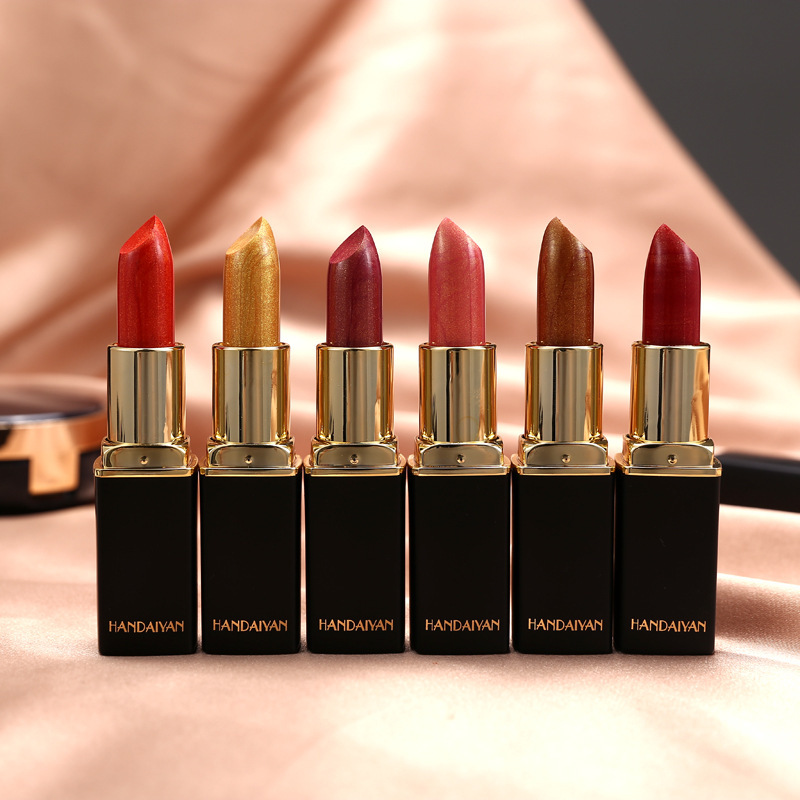 Row of assorted lipstick shades, makeup collection